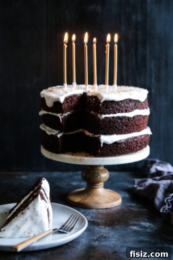 Decadent Dark Chocolate Cake with Fluffy Marshmallow Frosting 3 Close-up of a slice of Ultimate Dark Chocolate Cake with fluffy marshmallow frosting