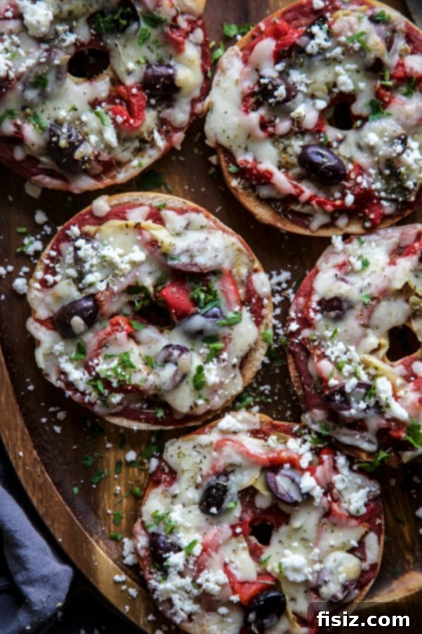 Overhead view of several Greek Pizza Bagels