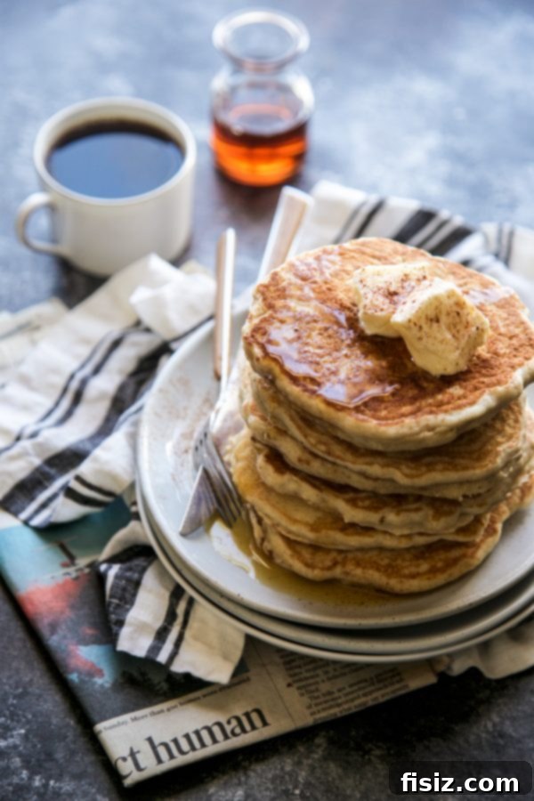 Fragrant Vietnamese Coffee Pancakes with Whipped Cinnamon Butter 3 Close-up of Vietnamese Coffee Pancakes on a plate with melted Cinnamon Butter and maple syrup