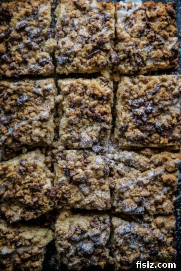Cardamom Pecan Crumb Cake 5 Slice of Cardamom-Spiced Pecan Crumb Cake drizzled with glaze
