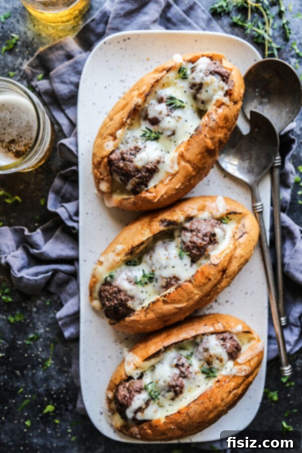 French Onion Meatball Sub Melts 2 Delicious French Onion Meatball Subs with melted provolone cheese on a hoagie roll