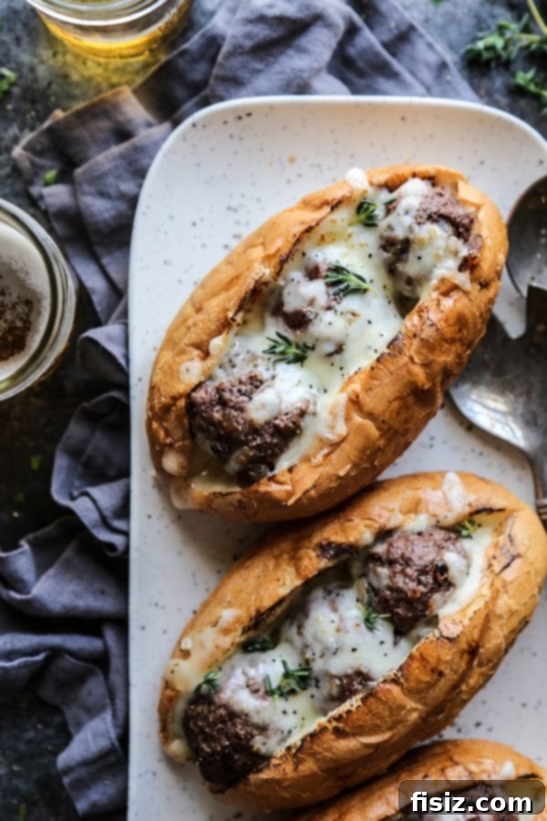 French Onion Meatball Sub Melts 3 Close-up of a French Onion Meatball Sub showing the rich caramelized onions and beef