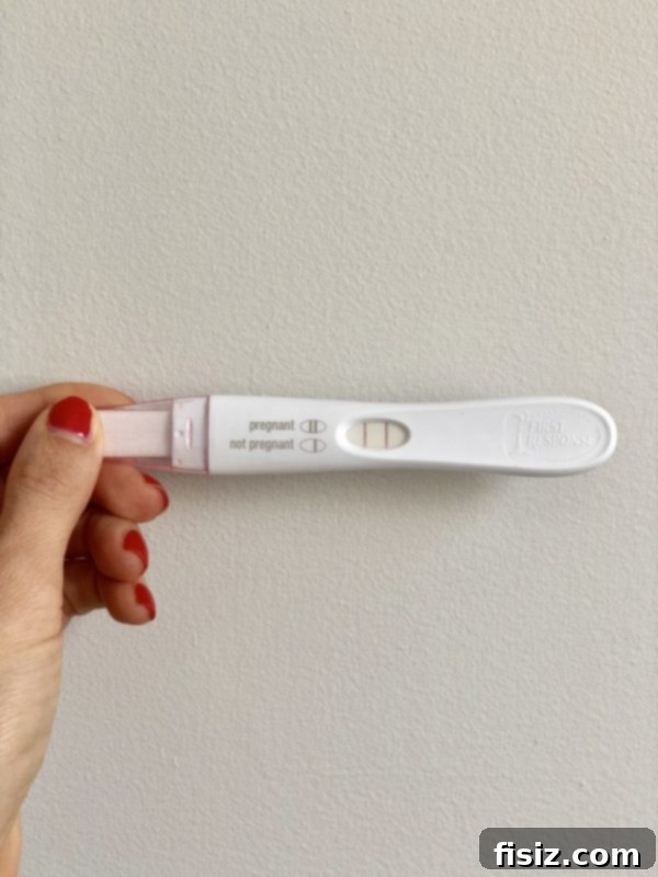 Trimester One The Start of Our Big Adventure 6 A positive pregnancy test stick, signifying the start of a new journey.