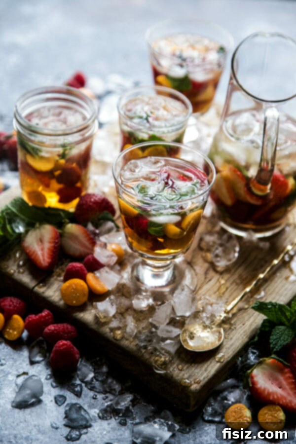 Minty Sweet Tea Sangria 2 Sweet Tea Sangria with Fresh Mint in a pitcher on a table