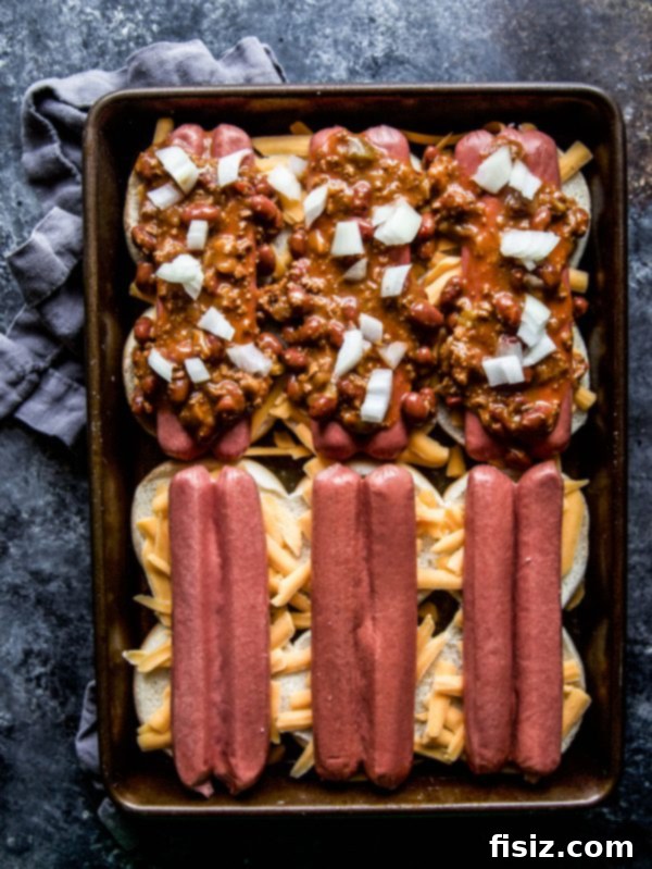 Baked Chili Cheese Dog Sliders 4 Top-down view of Chili Cheese Dog Baked Sliders arranged in a baking dish before baking