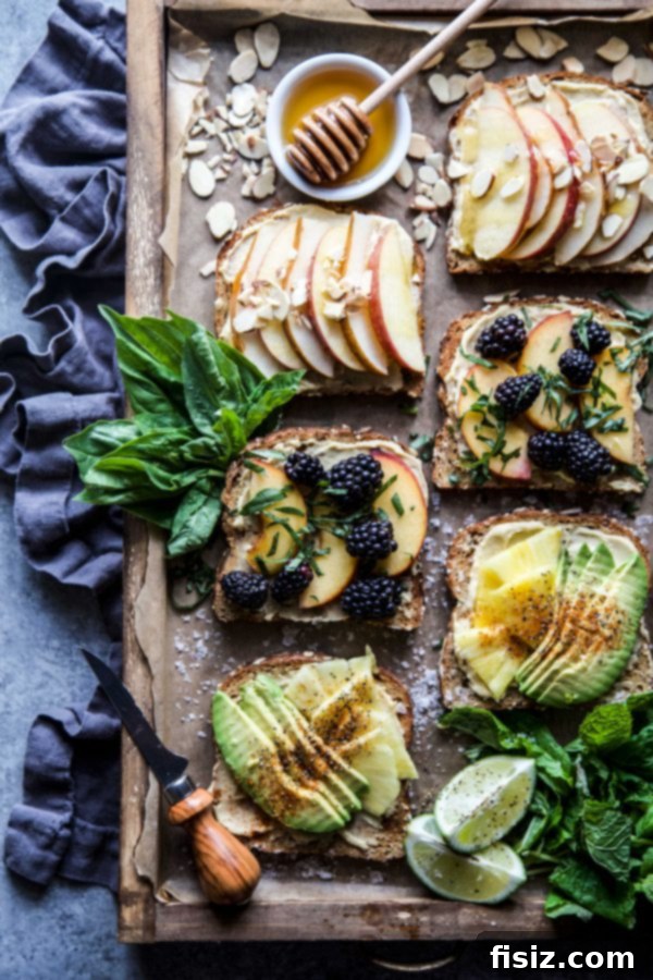 Three Delicious Hummus Toast Breakfasts 3 Close-up of a beautifully plated Hummus Breakfast Toast with a variety of toppings