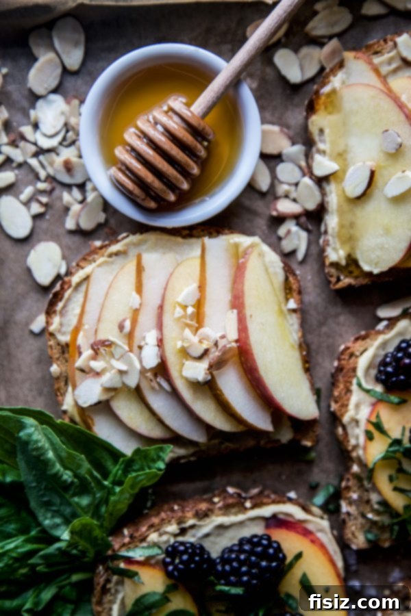 Three Delicious Hummus Toast Breakfasts 6 Hummus Breakfast Toast with sliced pears, apples, honey drizzle, and slivered almonds