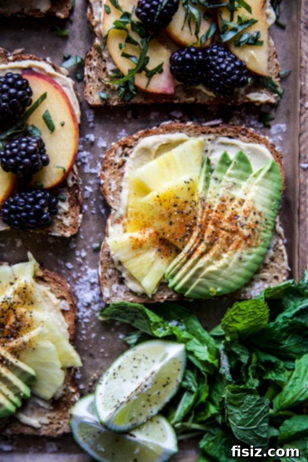Three Delicious Hummus Toast Breakfasts 7 Hummus Breakfast Toast featuring diced pineapple, avocado, and a sprinkle of chili lime seasoning