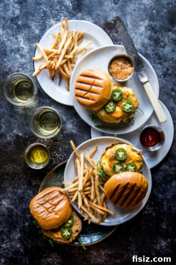 Signature Spiced Chicken Burgers 6 Spiced Chicken Burger with special sauce, arugula, and jalapenos on a brioche bun.
