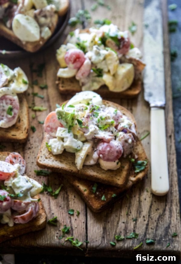 Ultimate Cobb Egg Salad Toasts 3 Cobb Egg Salad Toasts, showcasing the vibrant ingredients and creamy texture.