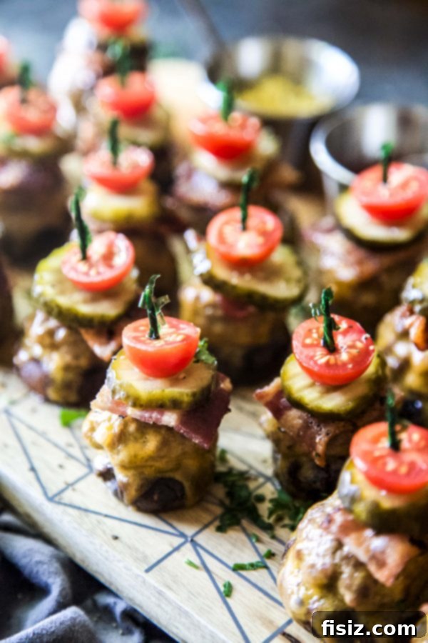 Loaded Bacon Cheeseburger Mushroom Bites 3 A beautifully arranged charcuterie board with various cheeses, meats, fruits, and nuts