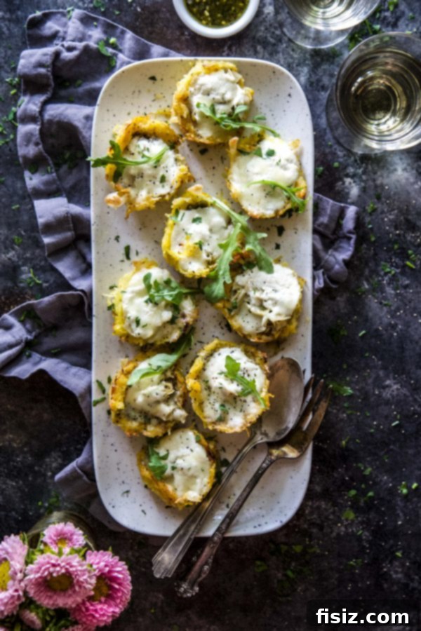 Plated Burrata & Pesto Spaghetti Squash Muffin Pizzas with a fresh green salad side