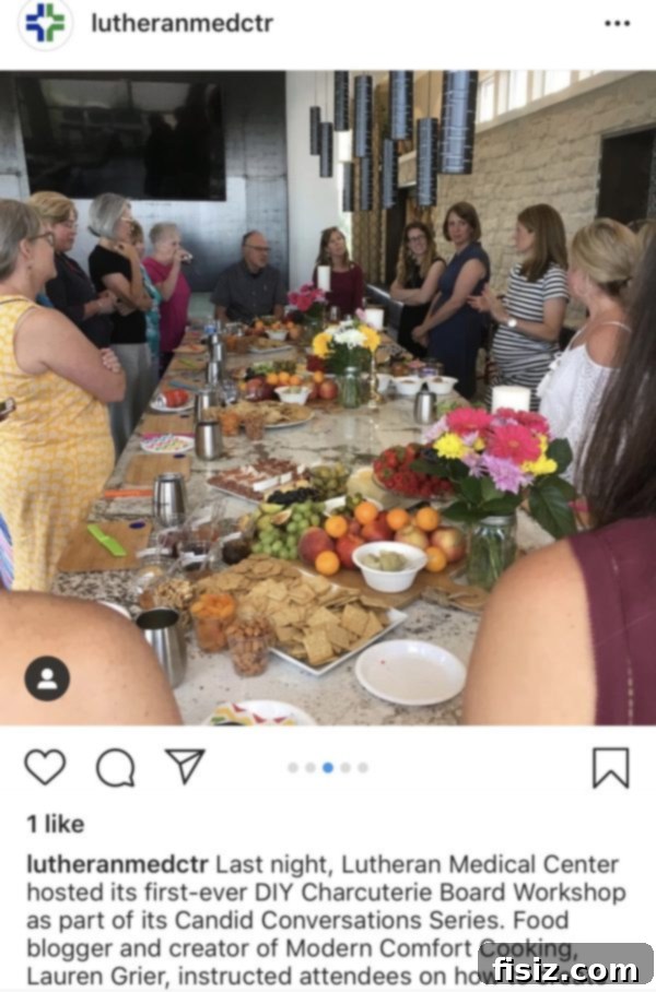 My Bump Update Weeks 23-27 9 Pregnant woman showcasing a beautifully arranged charcuterie board she prepared, highlighting her creative nesting.