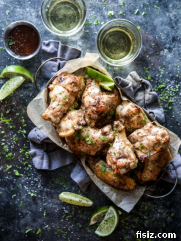 Pinoy Style Baked Chicken Wings 5 Close-up of baked Filipino chicken wings with a squeeze of fresh lime
