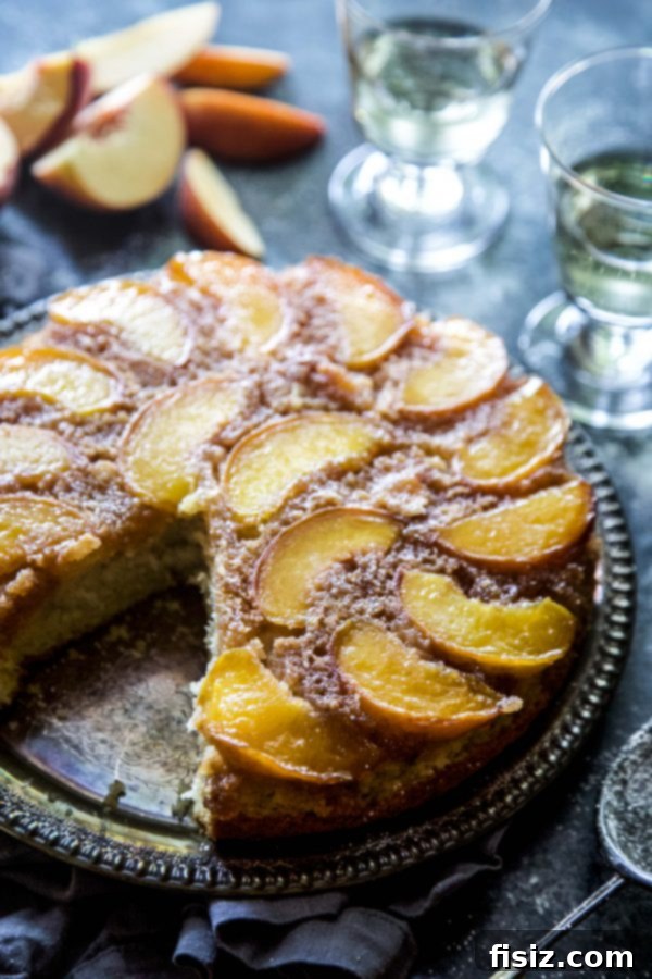 Golden Peach Upside Down Delight 3 Close-up of a slice of Peach Upside-Down Cake showing the juicy peaches