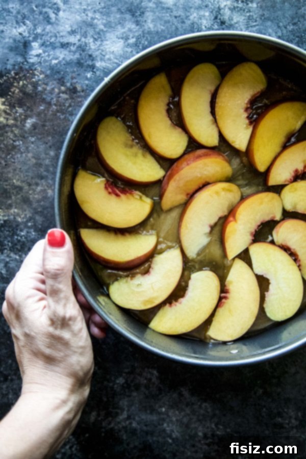 Golden Peach Upside Down Delight 4 Whole Peach Upside-Down Cake on a cooling rack, ready to be inverted