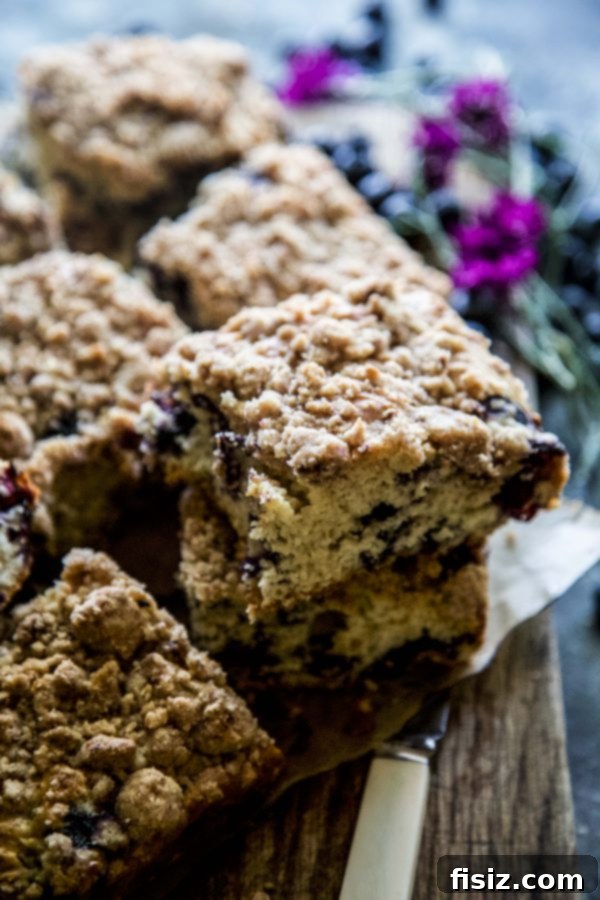 Cardamom-Kissed Blueberry Buckle Cake 6 Close-up of a slice of Blueberry Cardamom Buckle Cake with juicy blueberries