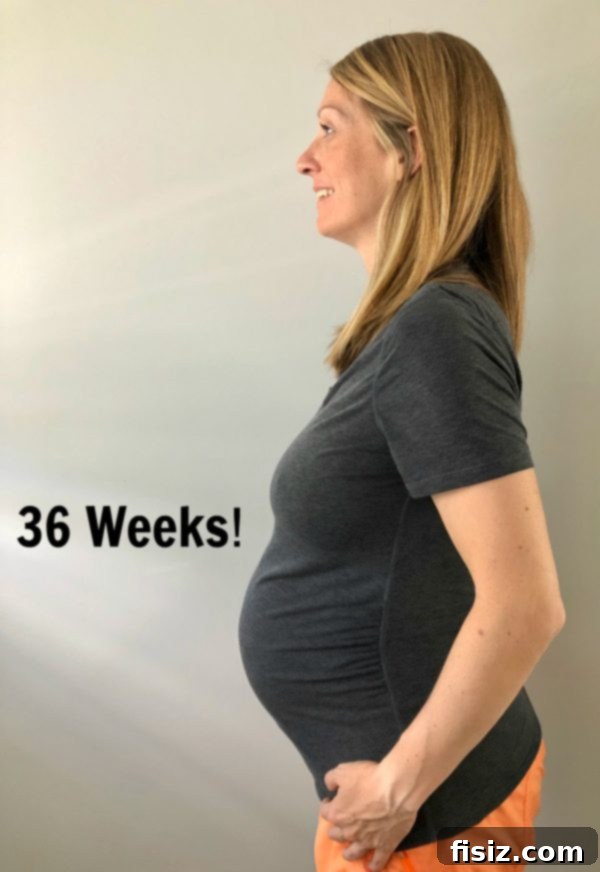 The Home Stretch: Weeks 33-37 9 Pregnant woman smiling, showcasing her comfort and joy in the third trimester of pregnancy.