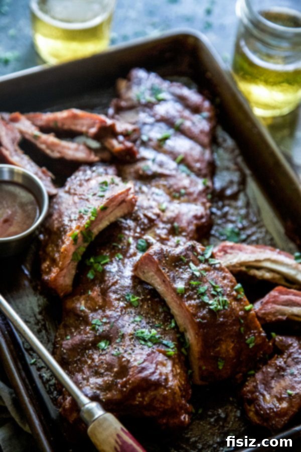 Apple Butter BBQ Ribs 6 Close-up of baked BBQ Apple Butter Baked Ribs, sliced and ready to serve