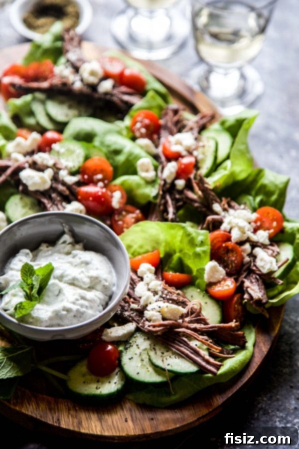 Za'atar-Spiced Slow-Cooked Steak Lettuce Wraps 6 Plated Slow Cooker Za'atar Steak Lettuce Wraps with fresh garnishes