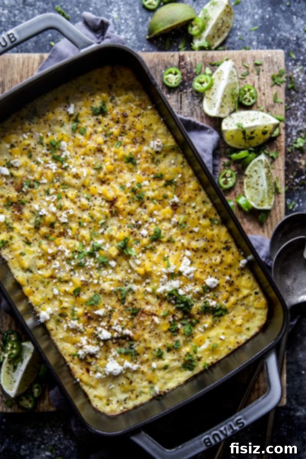 Mexican Street Corn Pudding 5 Side shot of Elote Corn Pudding, showing its creamy texture in a baking dish