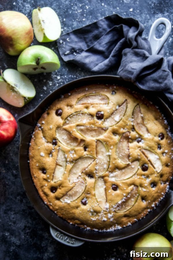 Sweet and Salty Apple Chocolate Skillet Delight 5 Salted Chocolate Chip Apple Skillet Cookie garnished with caramel.