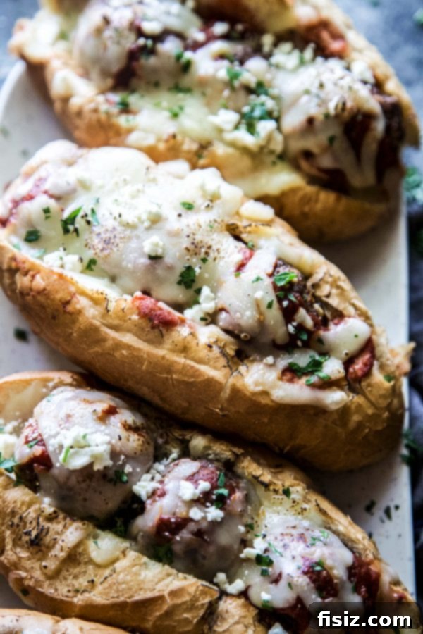 Aromatic Turkish Meatball Subs 3 Close-up of a Turkish Spiced Meatball Sub, showcasing melted cheese and rich sauce
