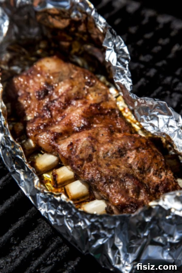 Bourbon Glazed American Lamb Ribs 5 American Lamb Ribs marinating in bourbon BBQ sauce before grilling