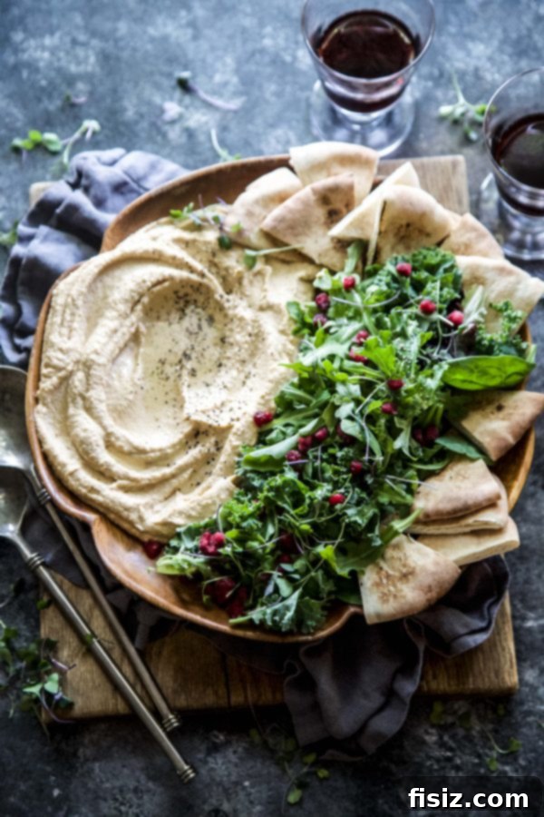 Golden Sweet Potato Hummus with Fresh Harvest Greens 4 Overhead shot of Sweet Potato Hummus and Harvest Greens beautifully arranged on a serving platter with garnishes