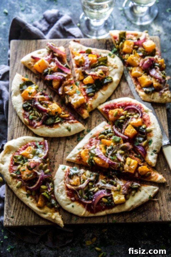 Roasted Butternut Squash and Poblano Three-Cheese Pizza 5 Close-up of freshly baked Roasted Butternut Squash & Poblano Three Cheese Pizza with garnishes
