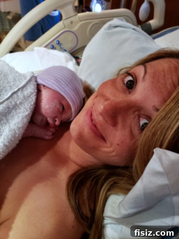 The Wonderful Arrival of Charlie 7 A newborn baby wrapped in a blanket, held by a parent.