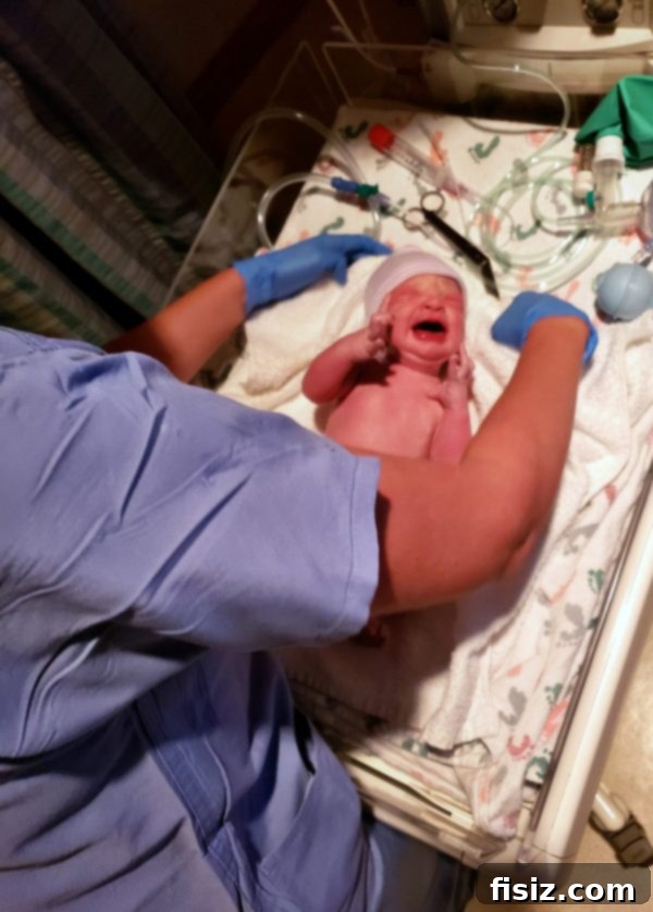 The Wonderful Arrival of Charlie 8 A newborn baby, named Charlie, sleeping peacefully in a hospital bassinet.