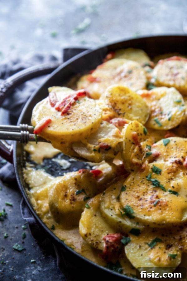 Chipotle Pimento Cheese Au Gratin Potatoes in a baking dish