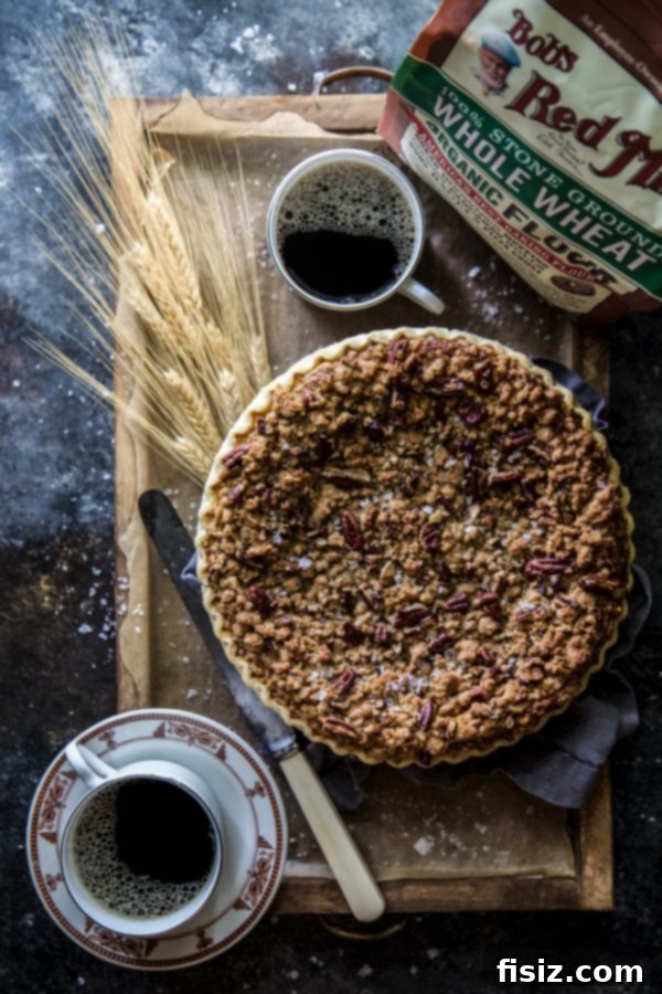 Decadent Salted Bourbon Pumpkin Pie with Pecan Streusel 5 Slice of Salted Bourbon Pumpkin Pie with Pecan Streusel ready to serve