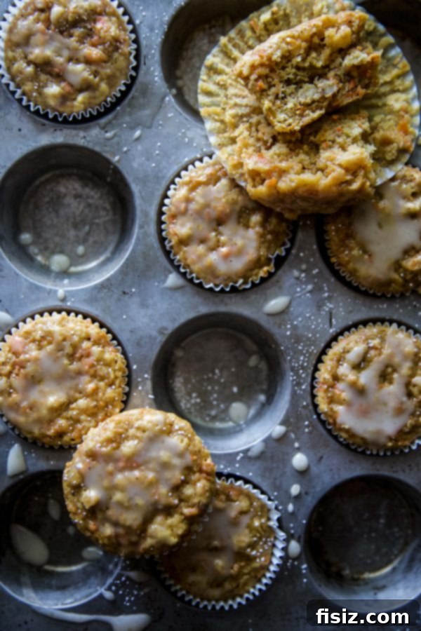 Bright Carrot Apple Muffins with Zesty Citrus Glaze 3 A stack of golden Carrot Apple Muffins, showcasing their fluffy texture