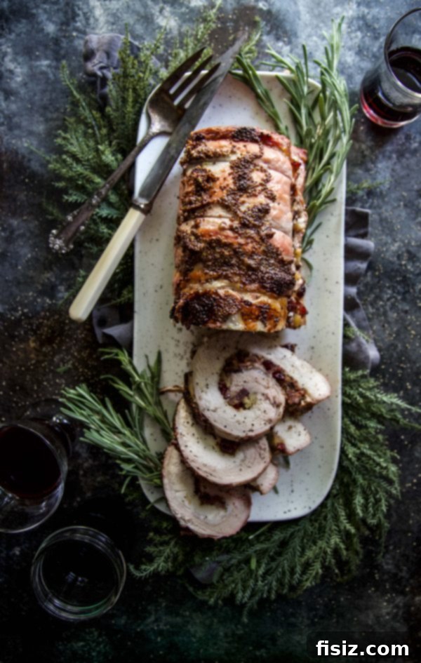 Bacon Cranberry Stuffed Pork Tenderloin 6 Sliced Bacon & Cranberry Stuffed Pork Tenderloin, revealing the vibrant filling