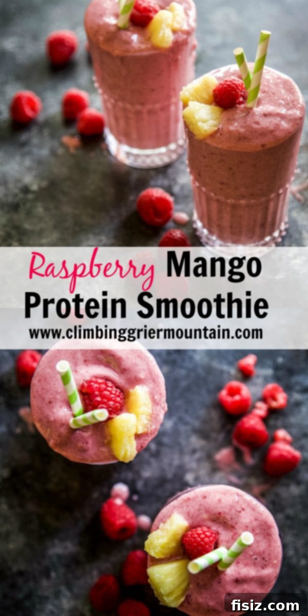 Tropical Raspberry Mango Protein Fuel 6 Two glasses of vibrant Raspberry Mango Protein Smoothie presented beautifully on a rustic wooden table.