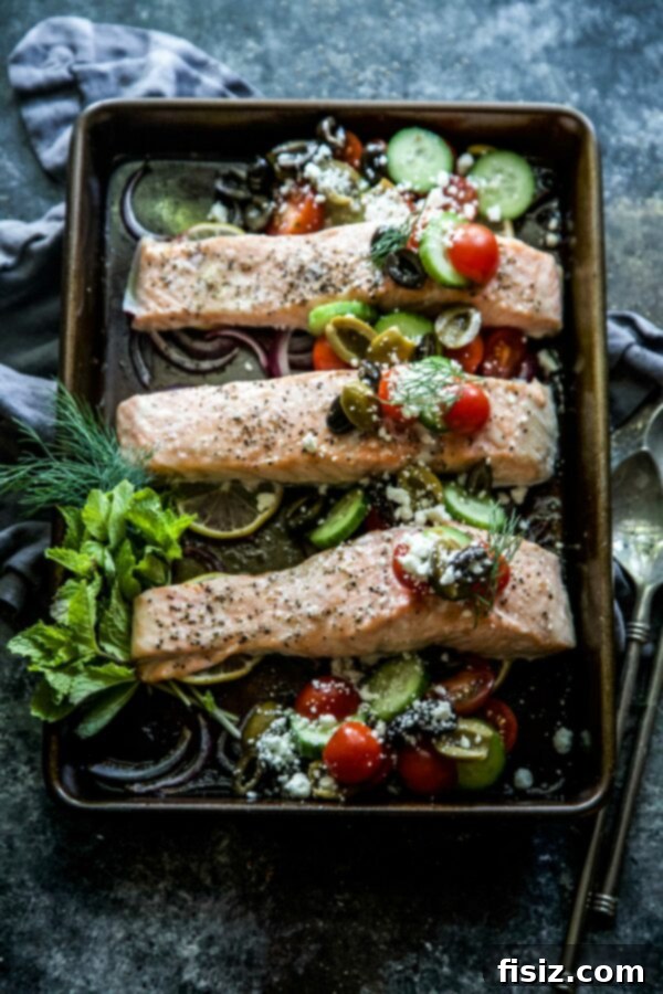 Delicious Greek Baked Salmon fillet with fresh herbs and vegetables