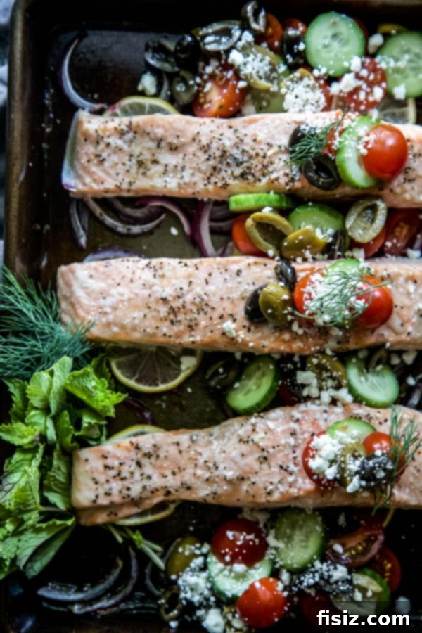 Close-up of Greek Baked Salmon with colorful feta and tomato topping