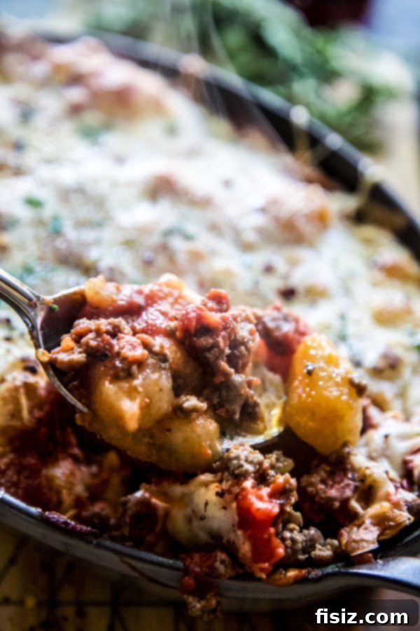Golden Cheesy Turkey Cauliflower Gnocchi Bake 4 A serving of Cheesy Turkey Cauliflower Gnocchi Bake, highlighting its rich, cheesy topping and wholesome ingredients.