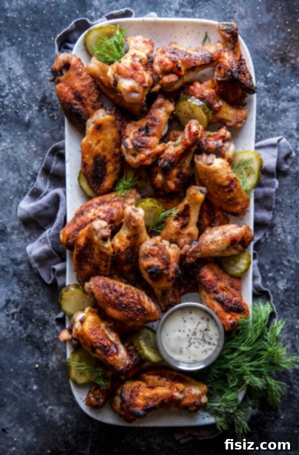 Crispy golden-brown Pickleback Baked Chicken Wings on a platter, ready to be served.