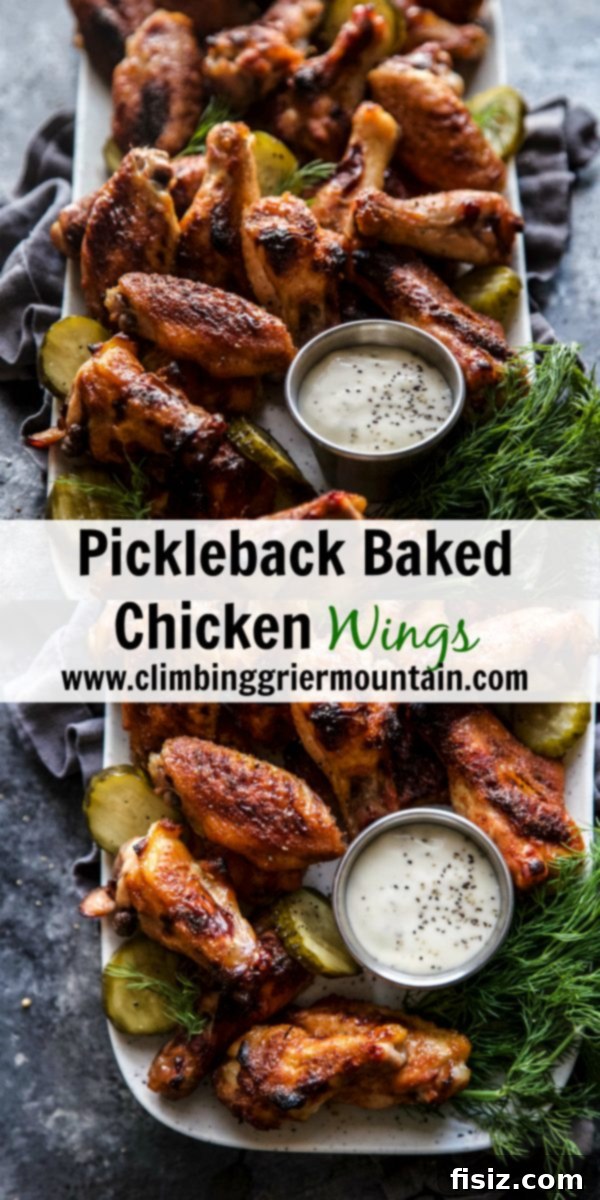 Beautifully glazed and crispy Pickleback Baked Chicken Wings piled high on a serving plate.