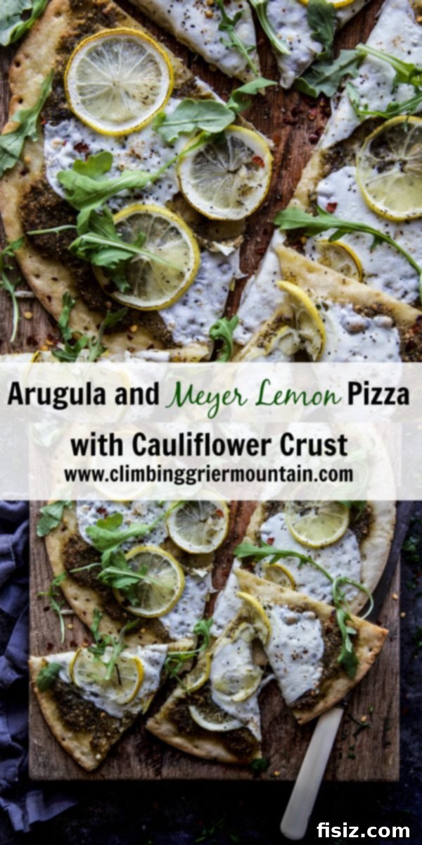 A perfectly sliced Arugula and Meyer Lemon Pizza on a wooden cutting board, showcasing its golden crust and fresh toppings, ready to be served.