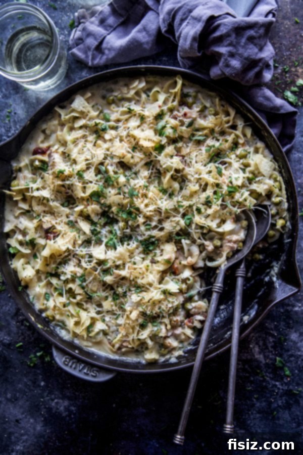 Rustic Tuscan Tuna Bake 3 A close-up of creamy Tuscan Tuna Casserole, showing the rich texture and herbs.