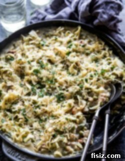 Rustic Tuscan Tuna Bake 6 Tuscan Tuna Casserole in a serving bowl with a spoon, ready to eat.