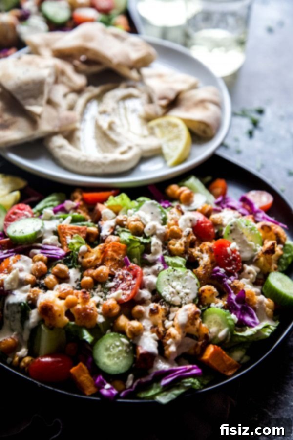 Vibrant Roasted Veggie Shawarma Bowls 5 A close-up of the roasted vegetables – cauliflower, chickpeas, and sweet potatoes – perfectly golden brown and spiced.