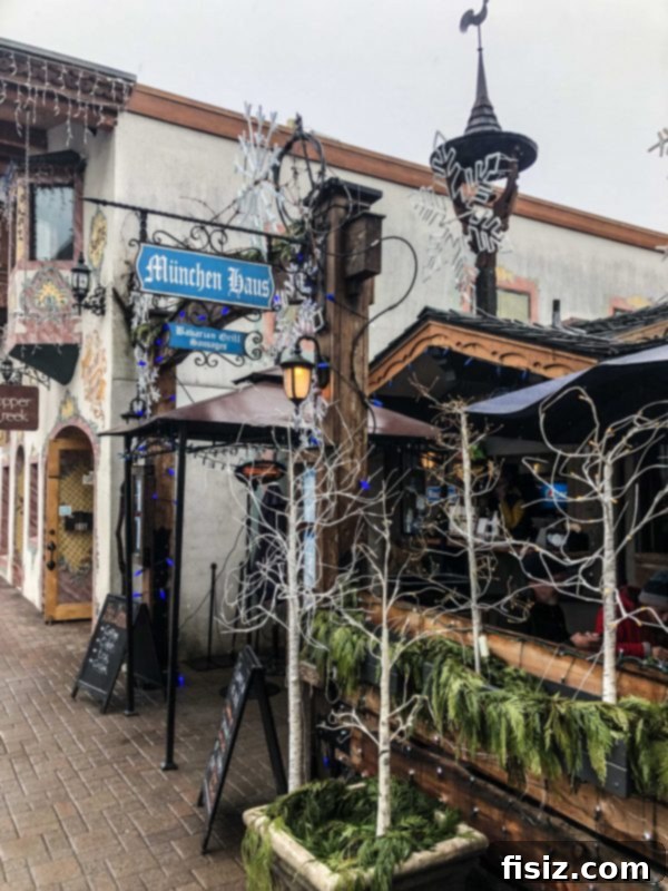 Leavenworth Washington A Bavarian Adventure Guide Stay Dine Explore 19 München Haus outdoor seating area with patrons enjoying food and beer.