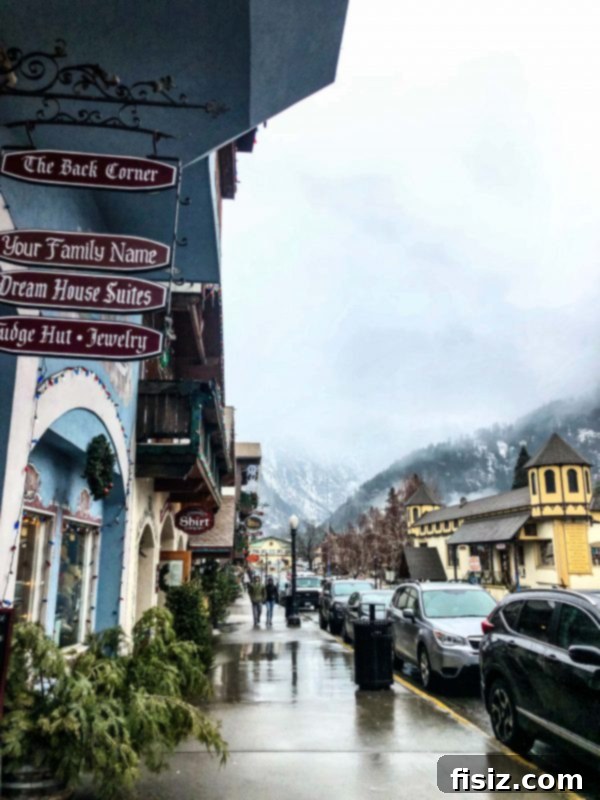 Leavenworth Washington A Bavarian Adventure Guide Stay Dine Explore 4 Road winding through snow-covered forest towards Leavenworth.