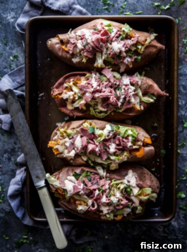 Golden Sweet Potatoes with Savory Corned Beef 5 Plated Corned Beef Stuffed Sweet Potatoes ready to serve
