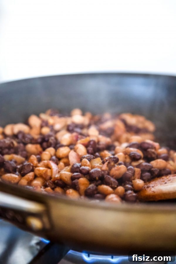 Irresistible Al Pastor Three Bean Quesadillas 5 Preparing the bean mixture in a skillet for Al Pastor Three Bean Quesadilla